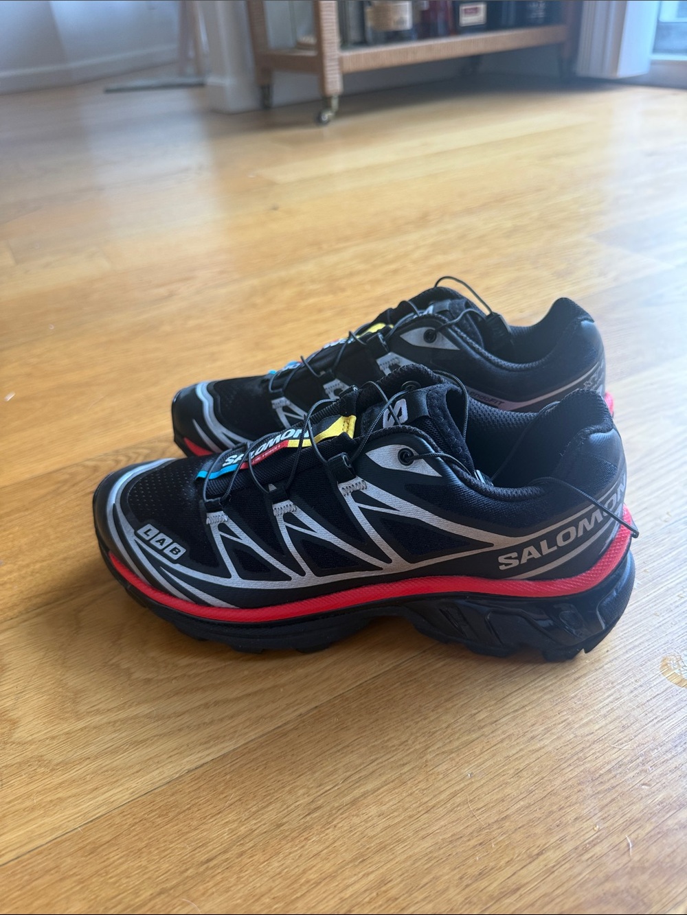 Salomon Black Sneakers with Red and Yellow Accents - Picture 2 of 3